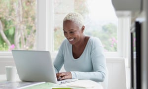 middle aged woman browsing on laptop