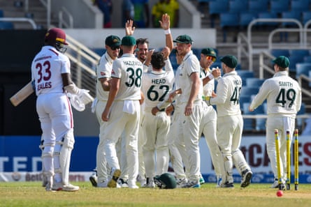 Mitchell Starc and Australia celebrate after defeating West Indies