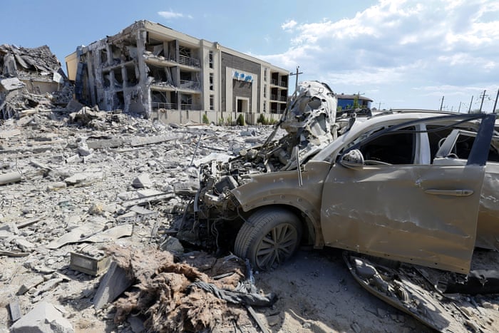 Views of a damaged resort building and a car caused by a rocket strike in the Odesa region.