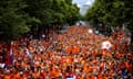 Dutch fans walk behind the Oranjebus in Munich. Bit of a squeeze.