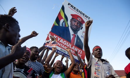 Supporters of Robert Kyagulanyi Ssentamu, otherwise known as Bobi Wine, cheer as he passes through Mukono.