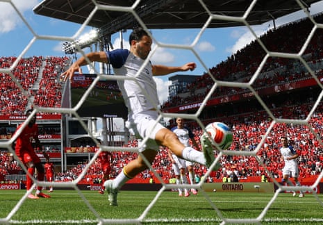 Bosnia and Herzegovina's Sead Kolasinac deflects the ball onto the crossbar after a shot.