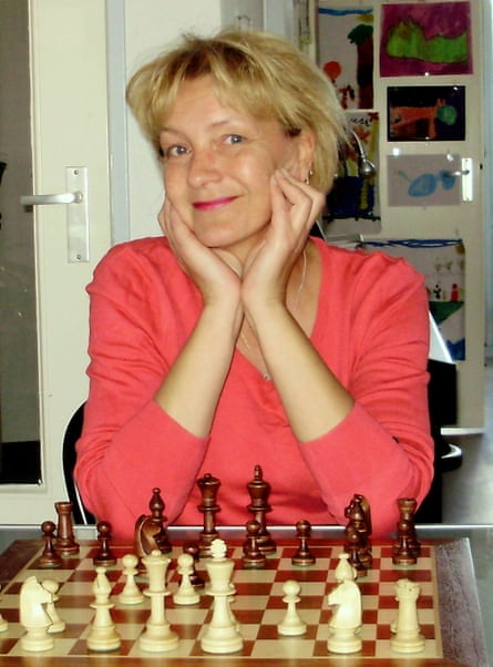 Debby Nieberg sits at a chess board.