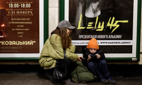 People in a metro station to shelter from an air raid in Kyiv.