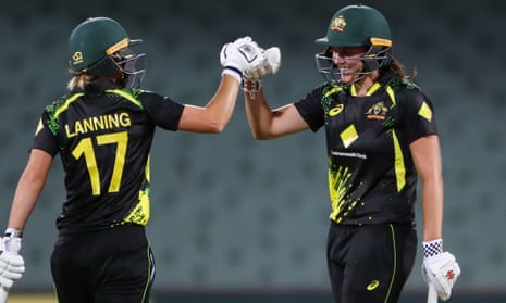 Meg Lanning and Tahlia McGrath of Australia celebrate victory.