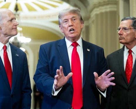 Donald Trump flanked by senators Rick Scott of Florida and John Barrasso of Wyoming after a lunch meeting with Senate Republicans on the Hill.
