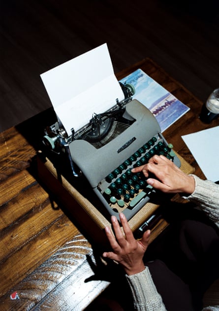 A person writing on a typewriter