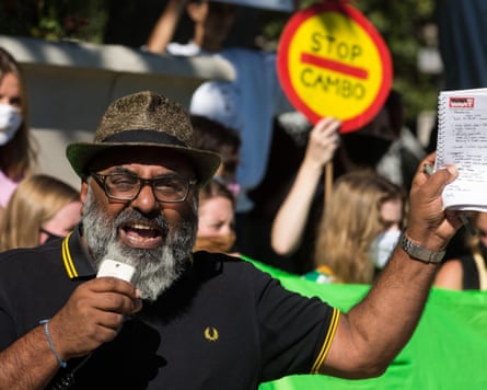 Rehman speaking with protesters around him