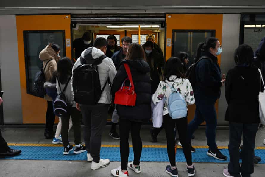 Sydney commuters entering a train