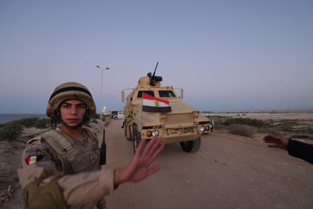 Egyptian soldiers patrol the Rafah-Gaza border crossing.