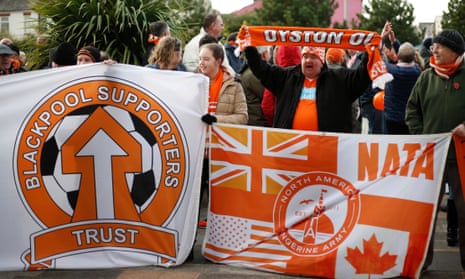 Blackpool fans protest outside Bloomfield Road before a match last year. 
