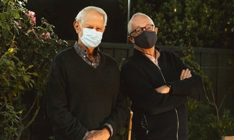 Robert Wilson, left, and Paul Milgrom wear masks as they stand for a photo in Stanford, California. The two American economists, both professors at Stanford, won the Nobel Prize in Economics for improving how auctions work. Monday, 12 October, 2020. 