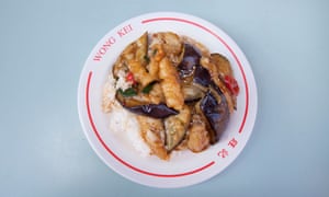 Sliced fish with aubergine on rice bowl.