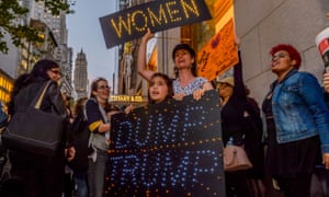 Women protest against Donald Trump outside the president-elect’s tower in New York city.