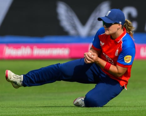 Dani Gibson holds on to catch to dismiss Richa Ghosh .