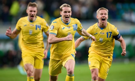 Mykhailo Mudryk (centre) celebrates after scoring the goal against Iceland that secured Ukraine’s place at Euro 2024.