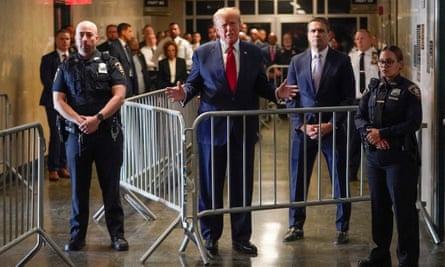 Trump speaks before entering the courtroom at Manhattan criminal court on 15 February 2024 for a pre-trial hearing.