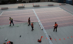 Organic printed solar cells on sub-millimetre thin plastic sheets being installed at the pilot project