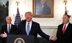 Donald Trump is flanked by Vice-President Mike Pence, left and the secretary of state, Mike Pompeo, while announcing the lifting of sanctions on Turkey at the White House on Wednesday.