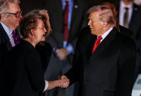 Yvette Cooper shaking hands with Donald Trump after he arrived at London Stansted Airport.