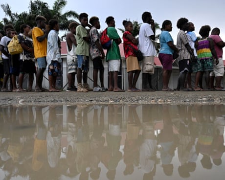 Solomon Islanders line up in Honiara