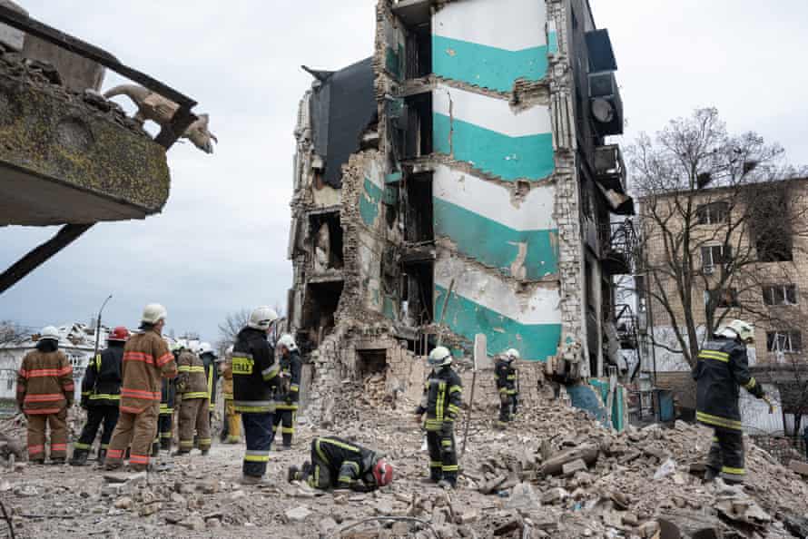 Rescue workers clear the rubble of an apartment building in Borodianka.