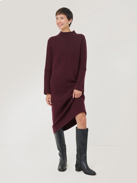 Model wearing burgundy sweater dress