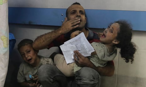 Wounded Palestinians receive treatment at al-Shifa hospital, following Israeli airstrikes on Gaza City.