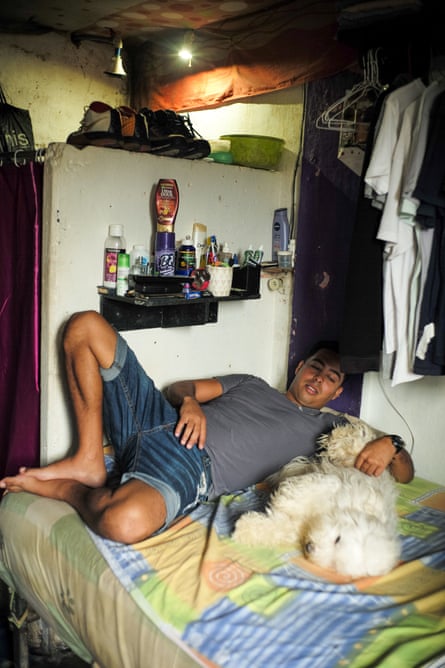 A man rests with his dog Chiqui.