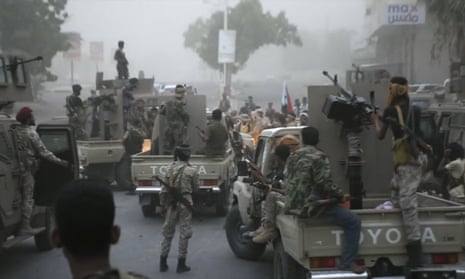 Separatist fighters, backed by the UAE, line up to storm the presidential palace in the southern port city of Aden.