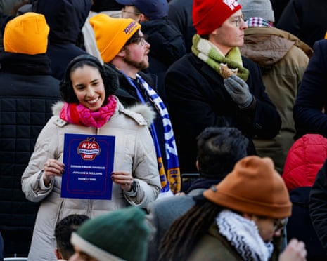 A guest holds a program on the day of Zohran Mamdani’s inauguration ceremony.