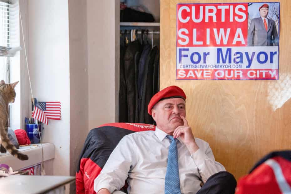 Sliwa in front of his mayor's sign.