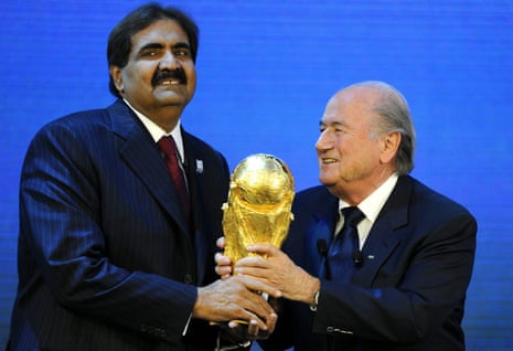 Sepp Blatter (right) gives the World Cup trophy to Sheikh Hamad bin Khalifa Al-Thani, Emir of Qatar, after Qatar was announced as host of the 2022 World Cup in December 2010.