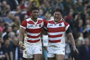 Japan’s Amanaki Mafi and Hiroshi Yamashita react after their victory over South Africa in the 2015 Rugby World Cup in Brighton, England.