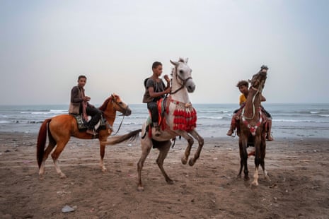 Gatherings on the beach, for horse riding, quad riding, kiting, swimming, or simply walking and chatting seem to be the only moment of leisure for an exhausted population in Aden, as pictured here in 2021