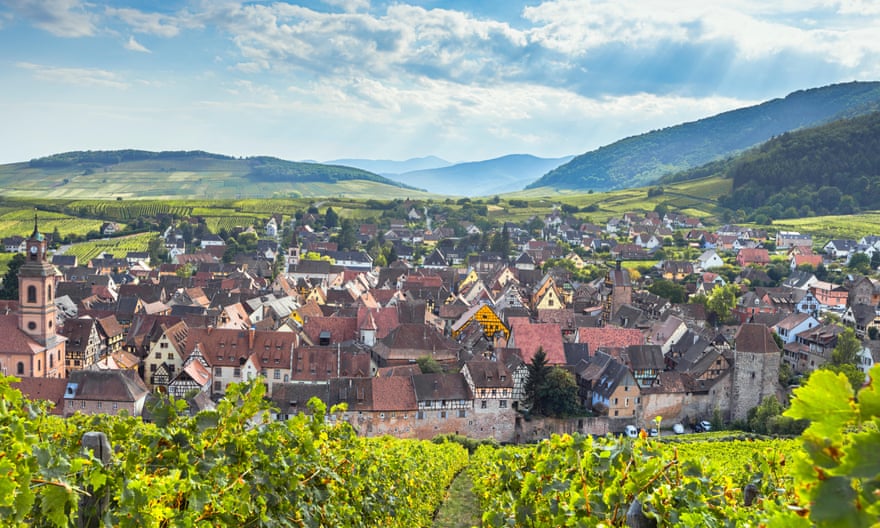 Wine village Riquewihr and the Vosges mountains.