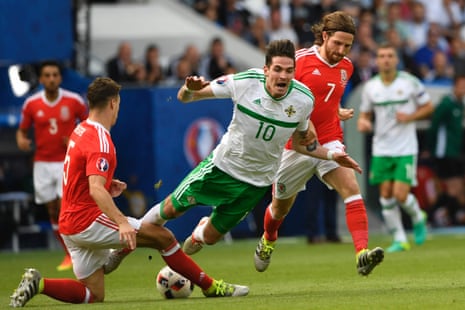 Wales’ defender James Chester, left, tackles Northern Ireland’s forward Kyle Lafferty.