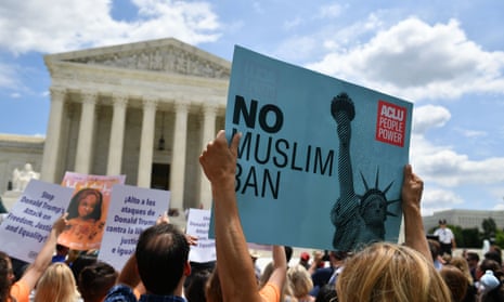 People protest the Muslim travel ban outside of the US supreme court in Washington DC on 26 June 2018.