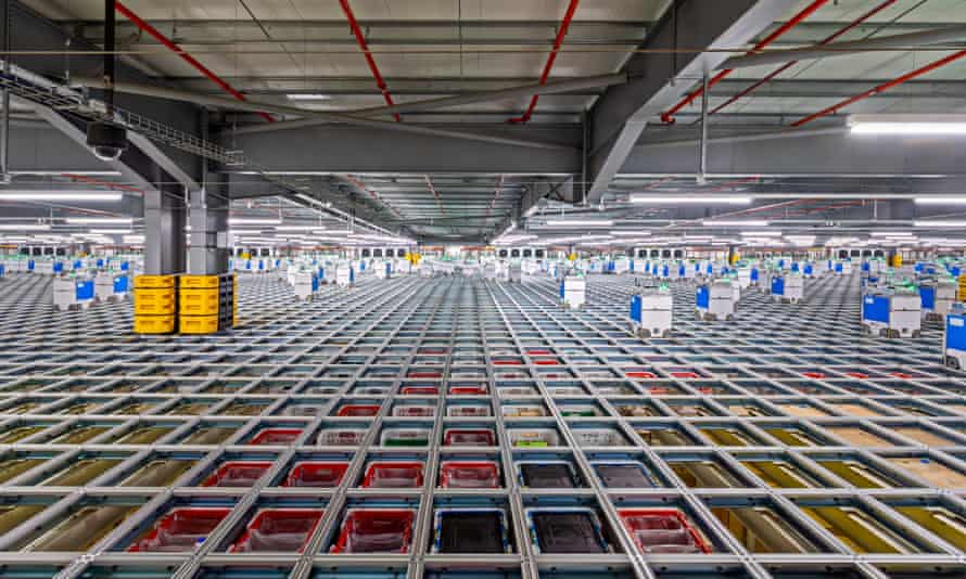 Robots picking products at Ocado’s warehouse in Erith, Kent.