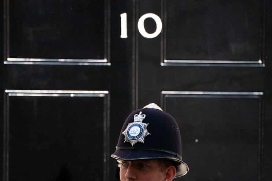 A Metropolitan Police officer stands outside 10 Downing Street.