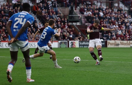 Lawrence Shankland shoots low to give Hearts the lead.