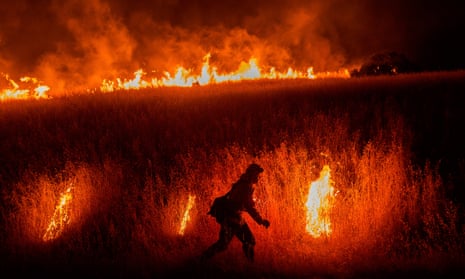 A firefighter battle the Quail Fire near Winters, California on 6 June 2020. 