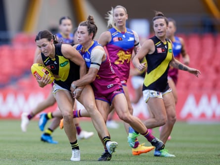 Tessa Lavey of the Tigers is tackled by Catherine Svarc of the Lions last weekend.