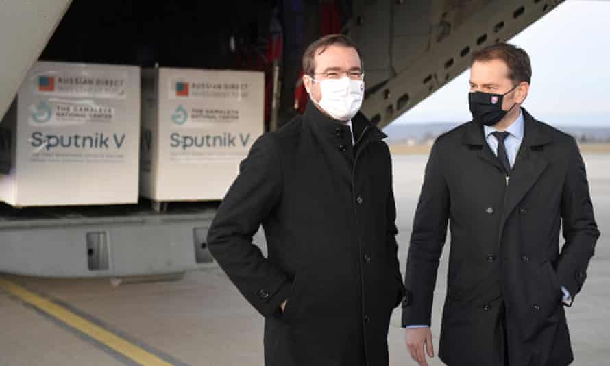 Former Slovak prime minister Igor Matovič, right, and health minister Marek Krajci at Kosice airportas Russia’s Sputnik V coronavirus vaccine arrives.