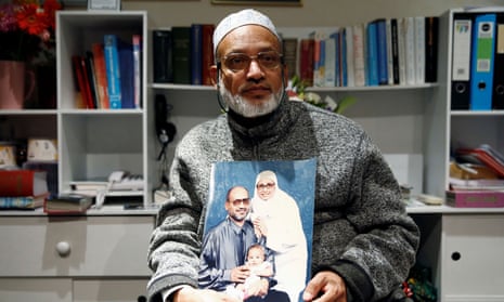 Al Noor mosque shooting survivor Farhid Ahmed poses with a photo of his wife Husna.