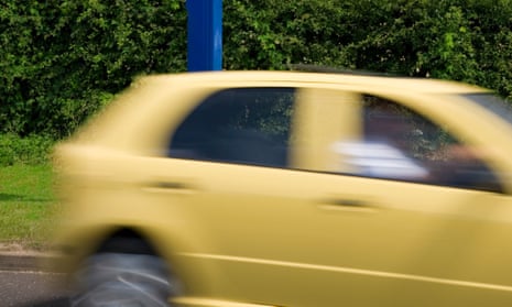 Yellow car passing speed camera