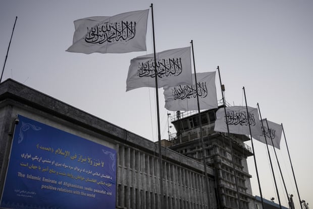 Taliban flags fly at Kabul airport on 9 September 2021 after foreign forces abandoned the capital.