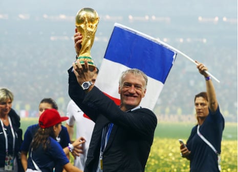 Didier Deschamps lifts World Cup trophy.