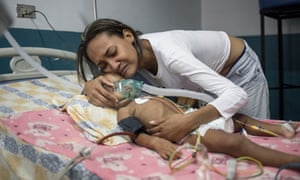María Baeza hugs her daughter, Luciannys Rivas.