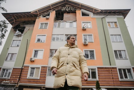 Usyk outside a bombed out apartment block just outside Kyiv.